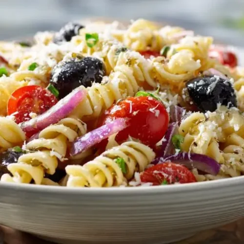 mediterranean pasta salad with olives cherry tomatoes red onion and herbs